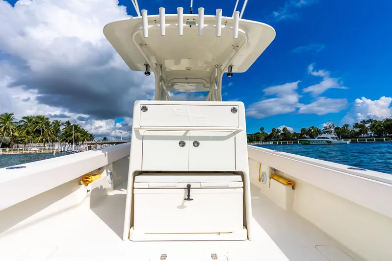  Yacht Photos Pics 2016 SeaVee 340Z boat on water, clear sky, palm trees in background.