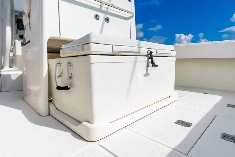  Yacht Photos Pics 2016 SeaVee 340Z boat deck with storage compartment under clear blue sky.