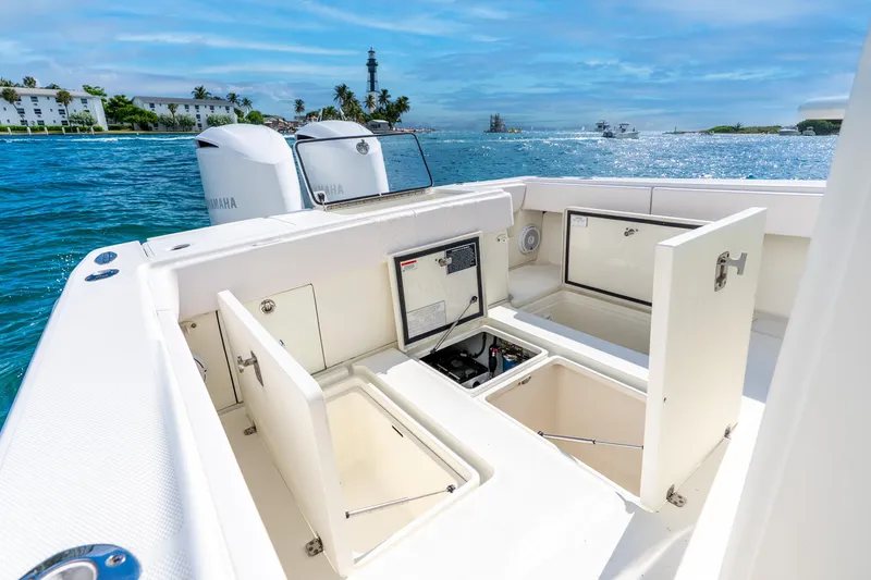  Yacht Photos Pics 2016 SeaVee 340Z boat with open storage compartments, Yamaha engines, and scenic ocean view.