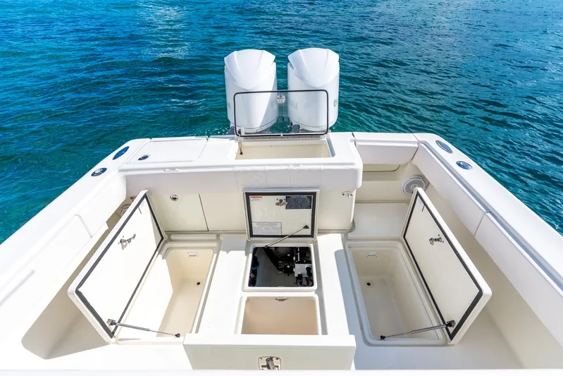  Yacht Photos Pics 2016 SeaVee 340Z boat deck with open storage compartments and twin engines.