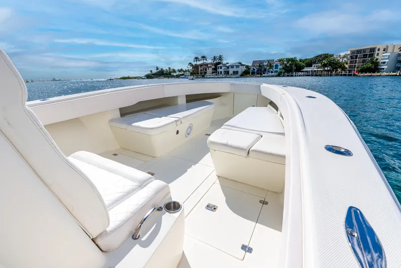 Yacht Photos Pics 2016 SeaVee 340Z boat interior with white seating, on a sunny waterfront.