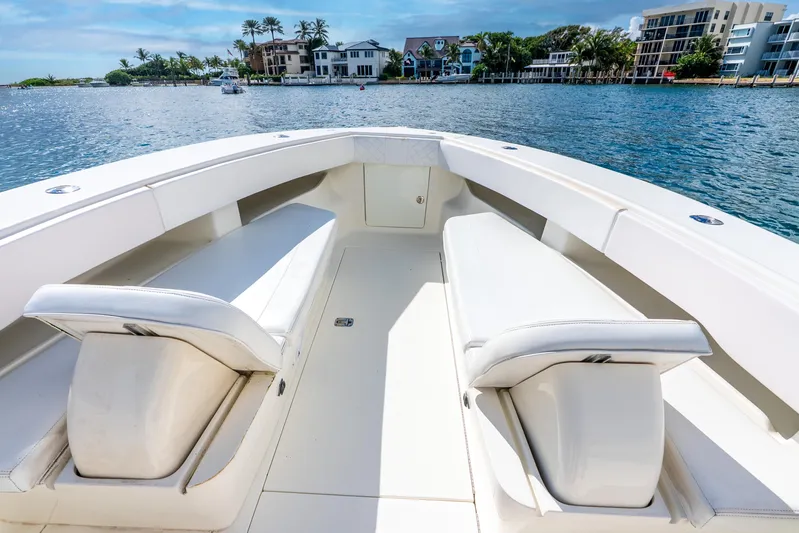  Yacht Photos Pics 2016 SeaVee 340Z boat interior with white seating, overlooking waterfront homes.