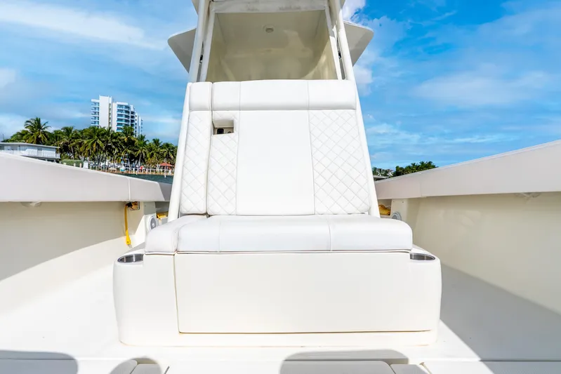  Yacht Photos Pics 2016 SeaVee 340Z boat with white seating, coastal backdrop, and blue sky.