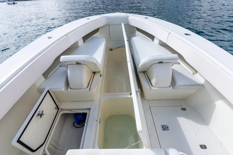  Yacht Photos Pics 2016 SeaVee 340Z boat interior with seating and storage compartments on calm water.