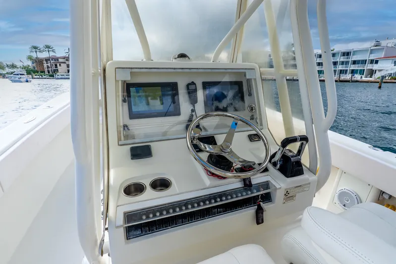  Yacht Photos Pics 2016 SeaVee 340Z boat dashboard with steering wheel and navigation equipment.