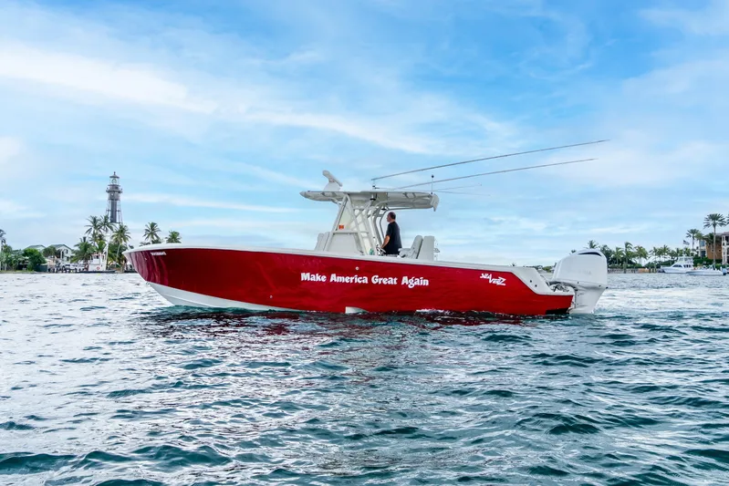  Yacht Photos Pics 2016 SeaVee 340Z boat with "Make America Great Again" slogan on water, lighthouse in background.