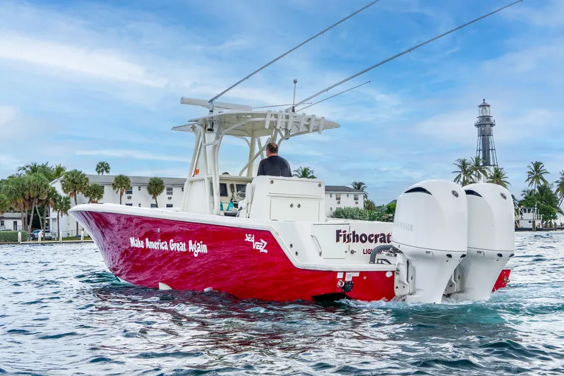  Yacht Photos Pics 2016 SeaVee 340Z boat with red hull and twin Yamaha engines on water.