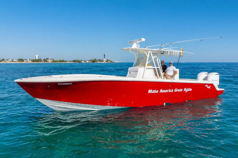  Yacht Photos Pics 2016 SeaVee 340Z boat in vibrant red on clear blue water.