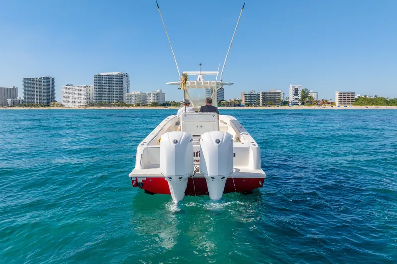  Yacht Photos Pics 2016 SeaVee 340Z boat cruising near a coastal city skyline.