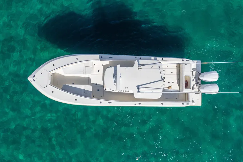  Yacht Photos Pics Aerial view of 2016 SeaVee 340Z boat on clear turquoise water.