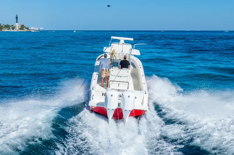  Yacht Photos Pics 2016 SeaVee 340Z boat cruising on open blue ocean waters.