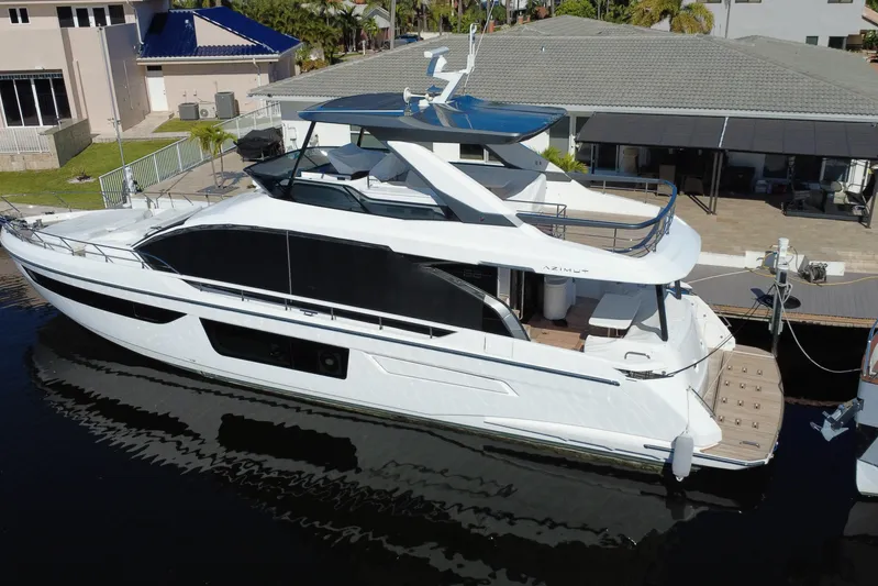  Yacht Photos Pics 2025 Azimut Fly 68 luxury yacht docked at marina, showcasing sleek design and modern features.