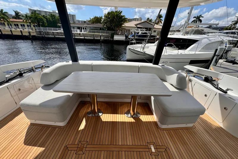  Yacht Photos Pics Luxurious seating area on 2025 Azimut Fly 68 yacht with waterfront view.