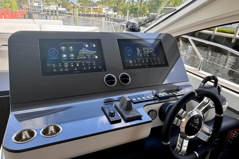  Yacht Photos Pics Helm of 2025 Azimut Fly 68 yacht with dual navigation screens and modern controls.