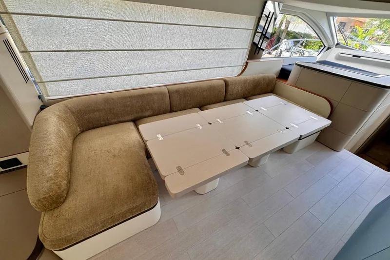  Yacht Photos Pics Luxurious interior of 2025 Azimut Fly 68 yacht with plush seating and modern table.