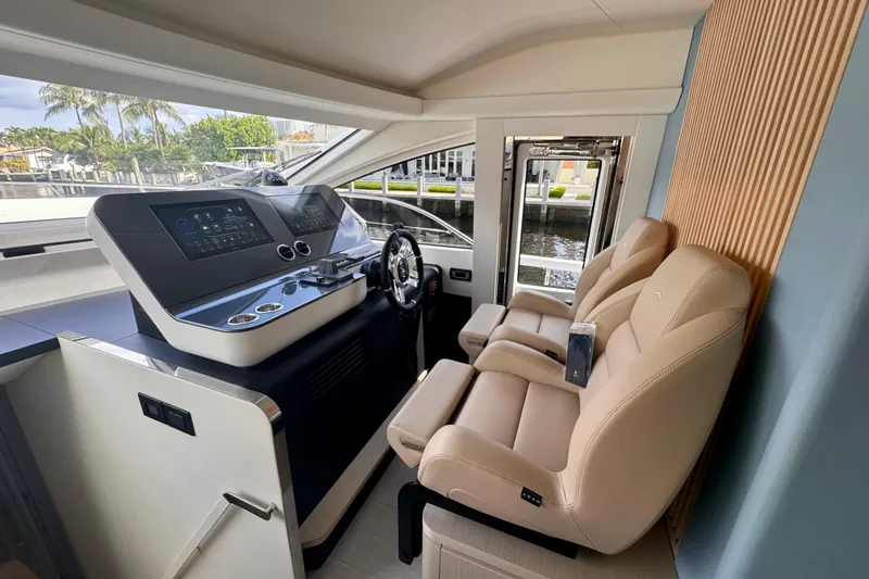  Yacht Photos Pics Luxurious helm of 2025 Azimut Fly 68 yacht with modern controls and plush seating.