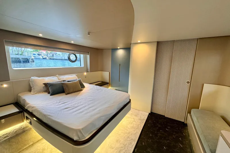  Yacht Photos Pics Luxurious bedroom interior of 2025 Azimut Fly 68 yacht with modern design.