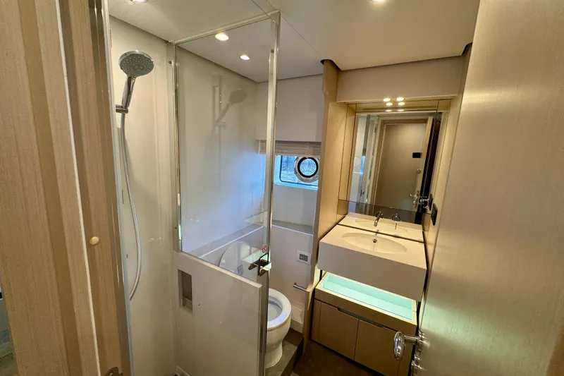  Yacht Photos Pics Luxurious bathroom in 2025 Azimut Fly 68 yacht, featuring modern fixtures and elegant design.