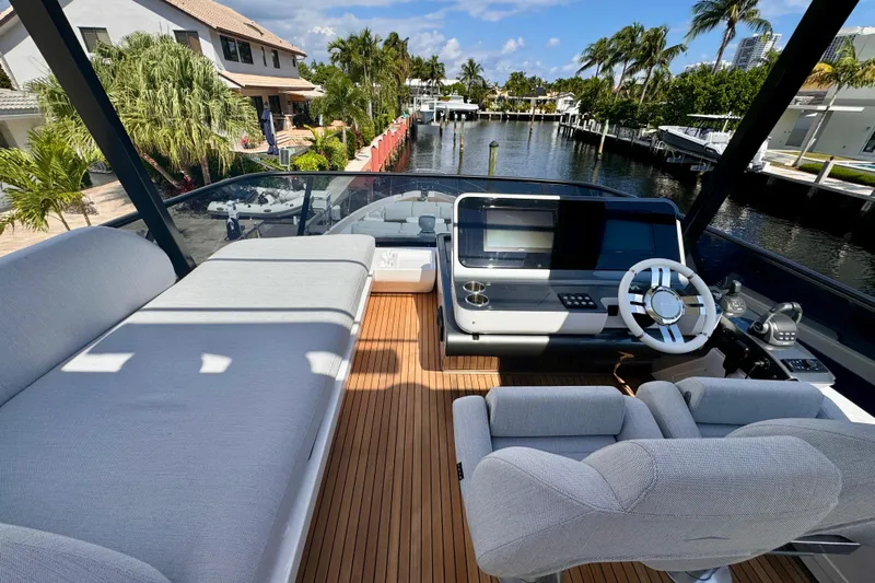  Yacht Photos Pics Luxurious Azimut Fly 68 yacht helm with modern controls and plush seating, 2025 model.