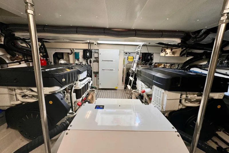  Yacht Photos Pics Engine room of 2025 Azimut Fly 68 yacht, showcasing dual engines and technical equipment.