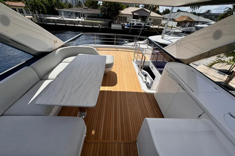  Yacht Photos Pics Luxurious 2025 Azimut Fly 68 yacht deck with elegant seating and sleek design.