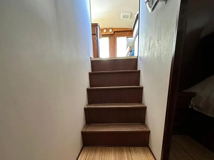  Yacht Photos Pics Staircase inside 1989 Hatteras 58 yacht, leading to upper cabin area.