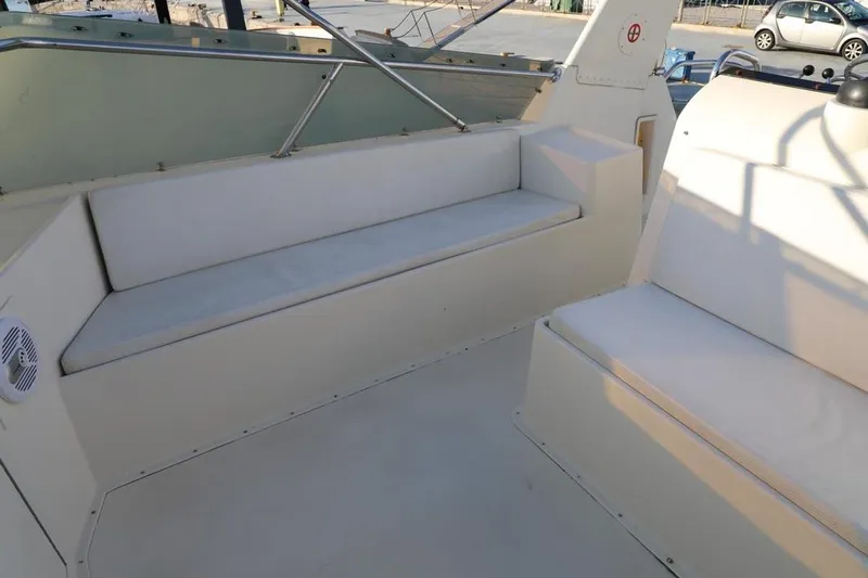  Yacht Photos Pics 1989 Hatteras 58 yacht interior with white seating and sleek design.