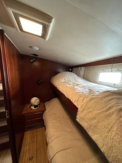  Yacht Photos Pics Cozy cabin with bunk beds in a 1989 Hatteras 58 yacht.