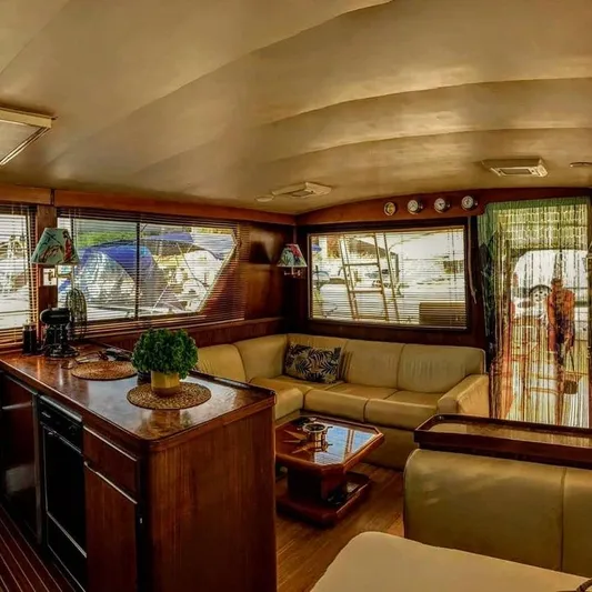  Yacht Photos Pics Luxurious interior of a 1989 Hatteras 58 yacht with elegant furnishings and decor.