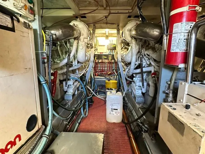  Yacht Photos Pics Engine room of a 1989 Hatteras 58 yacht, featuring dual engines and various equipment.