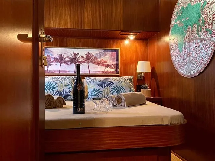  Yacht Photos Pics Luxurious cabin interior of 1989 Hatteras 58 yacht with wine and tropical decor.