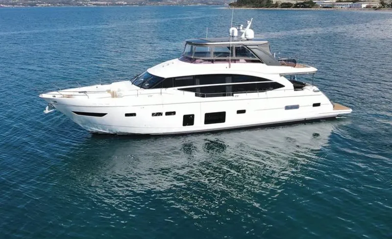  Yacht Photos Pics Luxurious 2019 Princess 75 yacht cruising on calm blue waters.