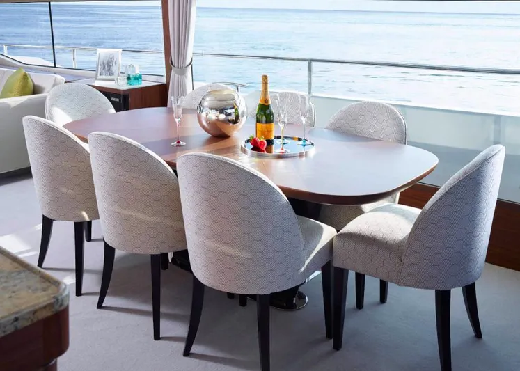 Yacht Photos Pics Luxurious dining area on 2019 Princess 75 yacht with ocean view and elegant table setting.