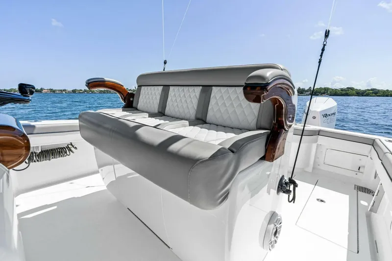 Lily Yacht Photos Pics 2021 Valhalla Boatworks V-33 interior with luxurious seating on a sunny day.