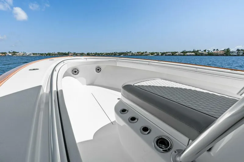 Lily Yacht Photos Pics 2021 Valhalla Boatworks V-33 interior with seating, on a sunny day by the water.