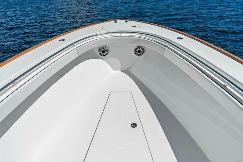 Lily Yacht Photos Pics 2021 Valhalla Boatworks V-33 bow with sleek design on calm water.