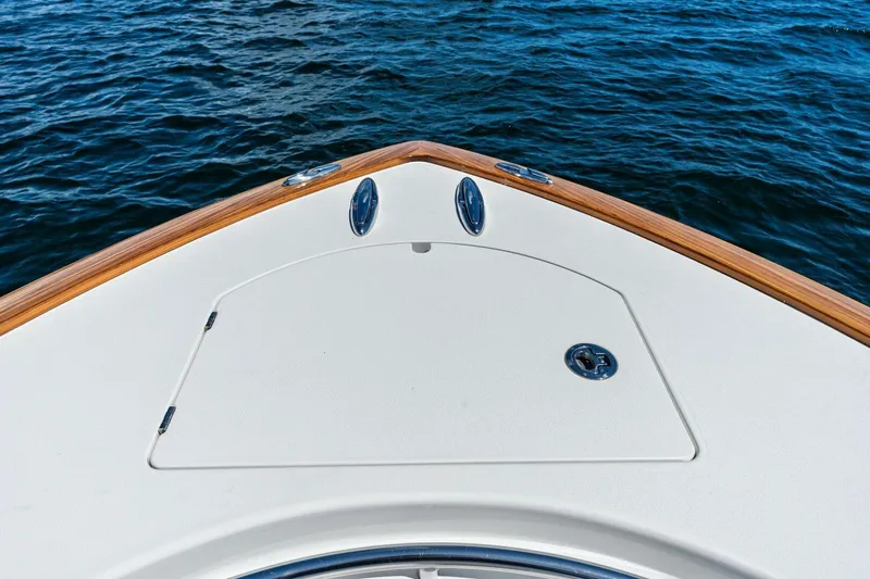 Lily Yacht Photos Pics Valhalla Boatworks V-33 2021 bow on water, showcasing sleek design and craftsmanship.