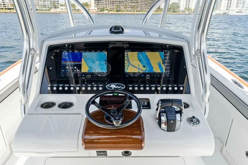 Lily Yacht Photos Pics 2021 Valhalla Boatworks V-33 helm with dual navigation screens and steering wheel.
