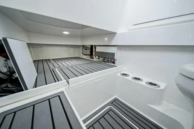 Lily Yacht Photos Pics 2021 Valhalla Boatworks V-33 interior with sleek, modern design and storage compartments.