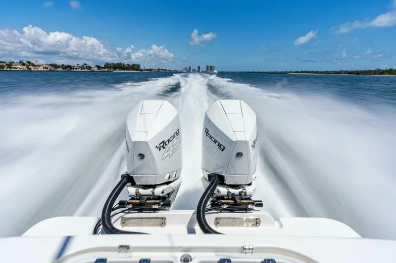 Lily Yacht Photos Pics 2021 Valhalla Boatworks V-33 speeding on water with twin outboard engines.