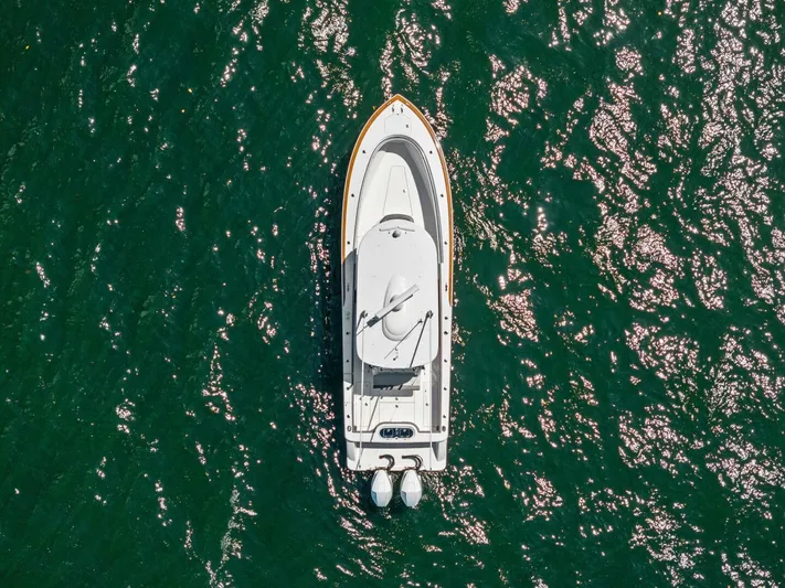 Lily Yacht Photos Pics Aerial view of 2021 Valhalla Boatworks V-33 on shimmering green water.