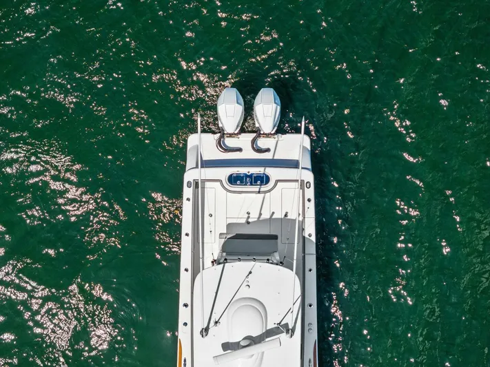 Lily Yacht Photos Pics Aerial view of 2021 Valhalla Boatworks V-33 on green water.