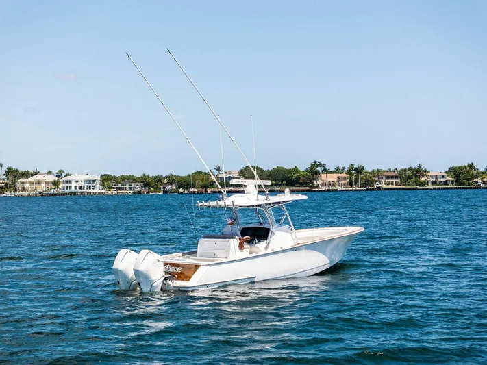 Lily Yacht Photos Pics 2021 Valhalla Boatworks V-33 on calm water, featuring dual outboard engines.