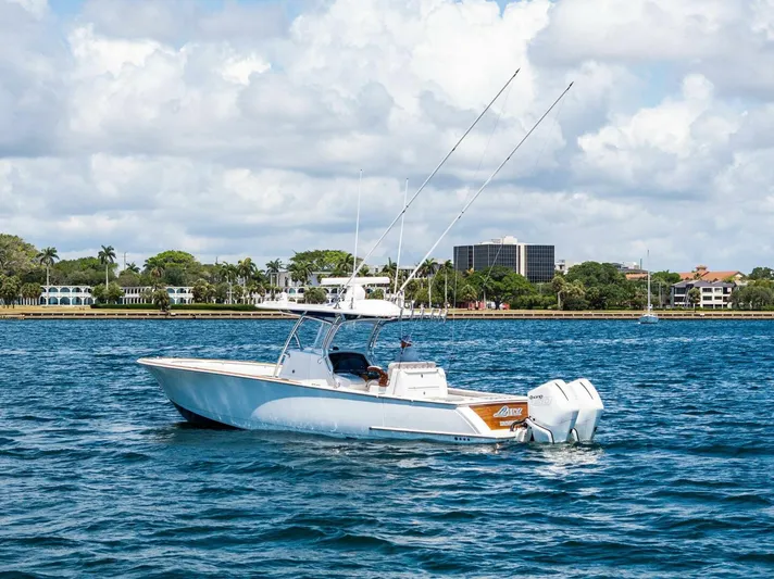 Lily Yacht Photos Pics 2021 Valhalla Boatworks V-33 on water, clear sky, coastal background.