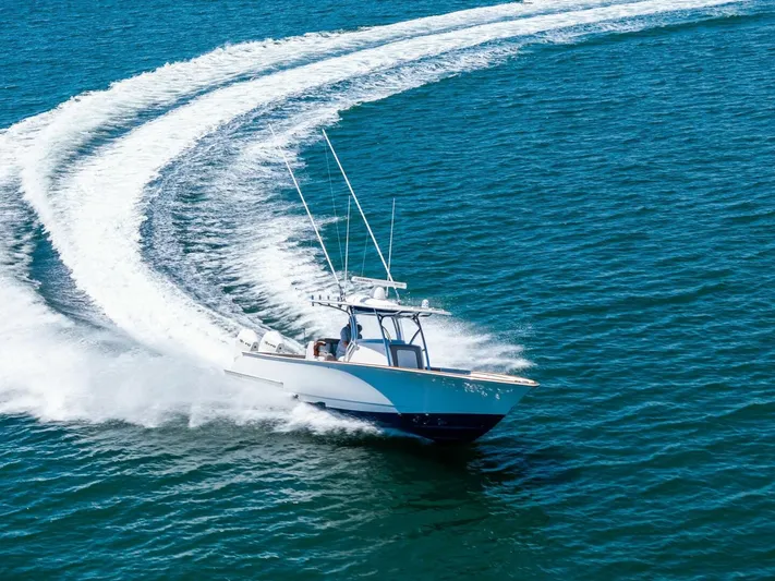 Lily Yacht Photos Pics 2021 Valhalla Boatworks V-33 cruising swiftly on open blue water.