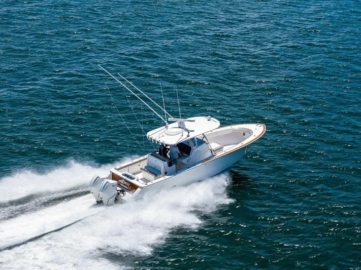 Lily Yacht Photos Pics 2021 Valhalla Boatworks V-33 cruising on open water, showcasing speed and performance.