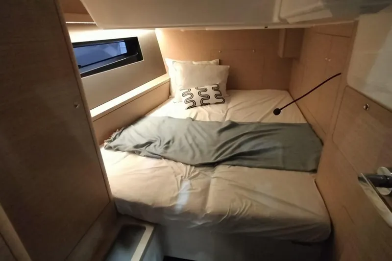  Yacht Photos Pics 2024 Dufour 44 yacht cabin with cozy bed and modern design.