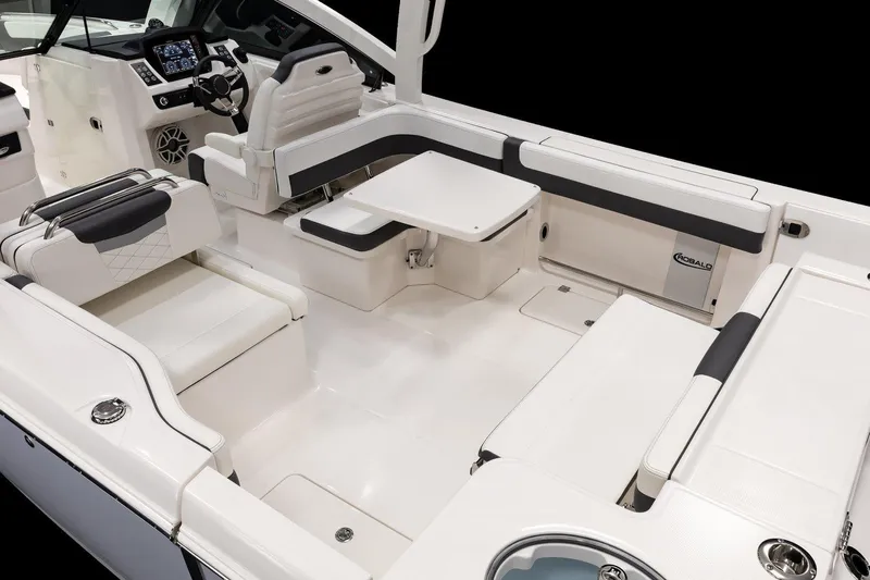  Yacht Photos Pics Manufacturer Provided Image: 2026 Robalo R277 Dual Console boat interior with white seating and modern dashboard.