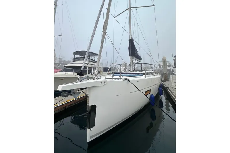 Pain Killer Yacht Photos Pics 2020 Bavaria C50 yacht docked in a foggy marina, featuring sleek design and modern amenities.