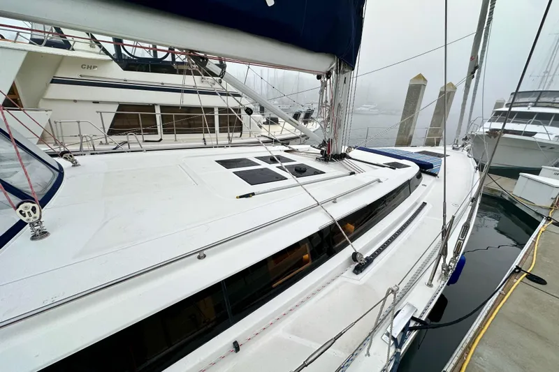 Pain Killer Yacht Photos Pics 2020 Bavaria C50 yacht docked in a foggy marina, showcasing sleek design and modern features.